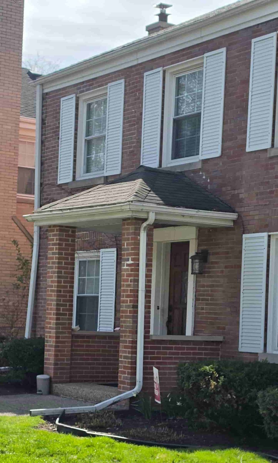 Brick residential homes in Edgebrook, Chicago, with front lawns, mature trees, and traditional entry details.