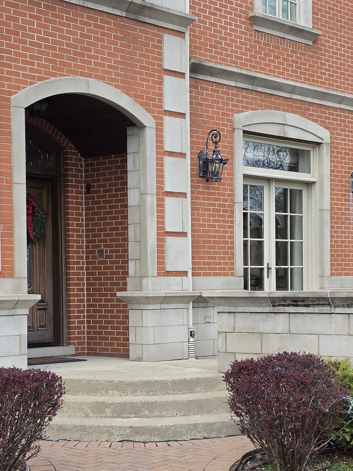 Brick residential exterior with stone trim in Lincolnwood, Illinois