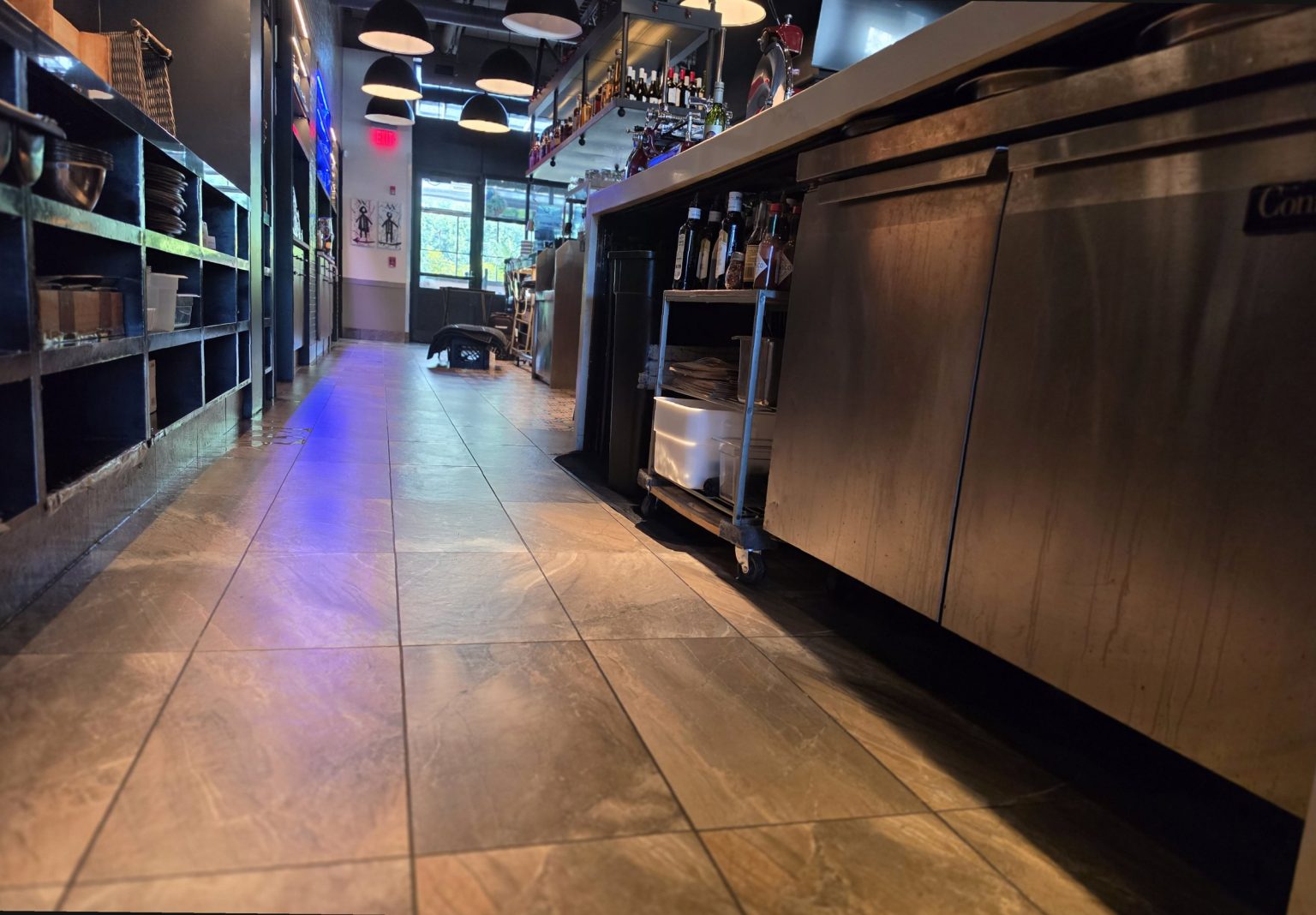 Restaurant bar service aisle with stools and service equipment