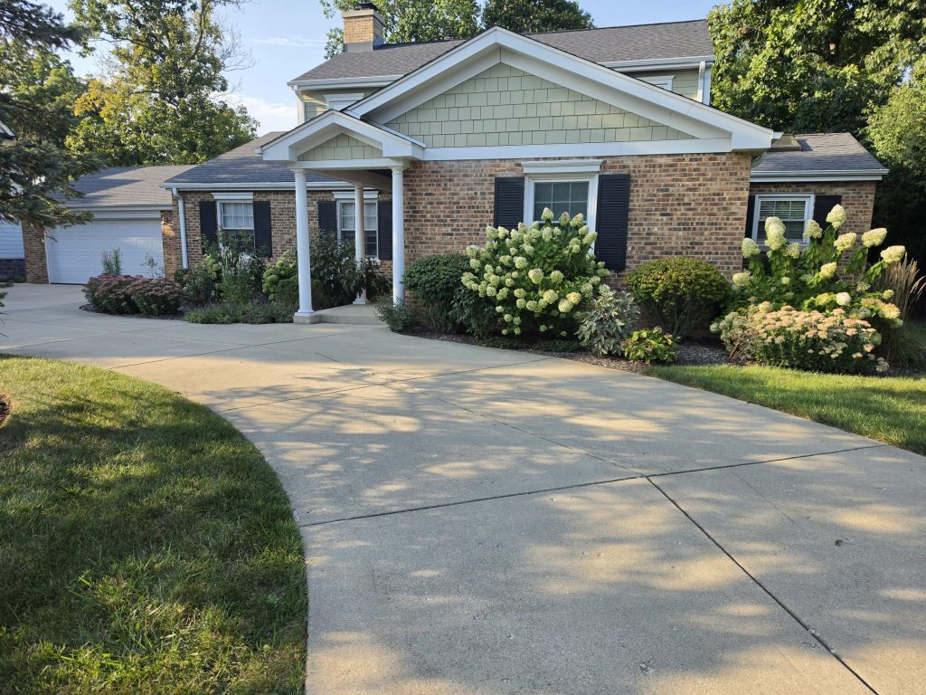 Suburban house and garage with front driveway in Glenview
