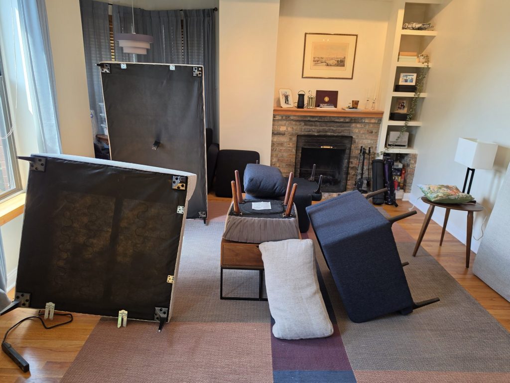 Furniture and cushions moved aside in a Lakeview living room for bed bug treatment
