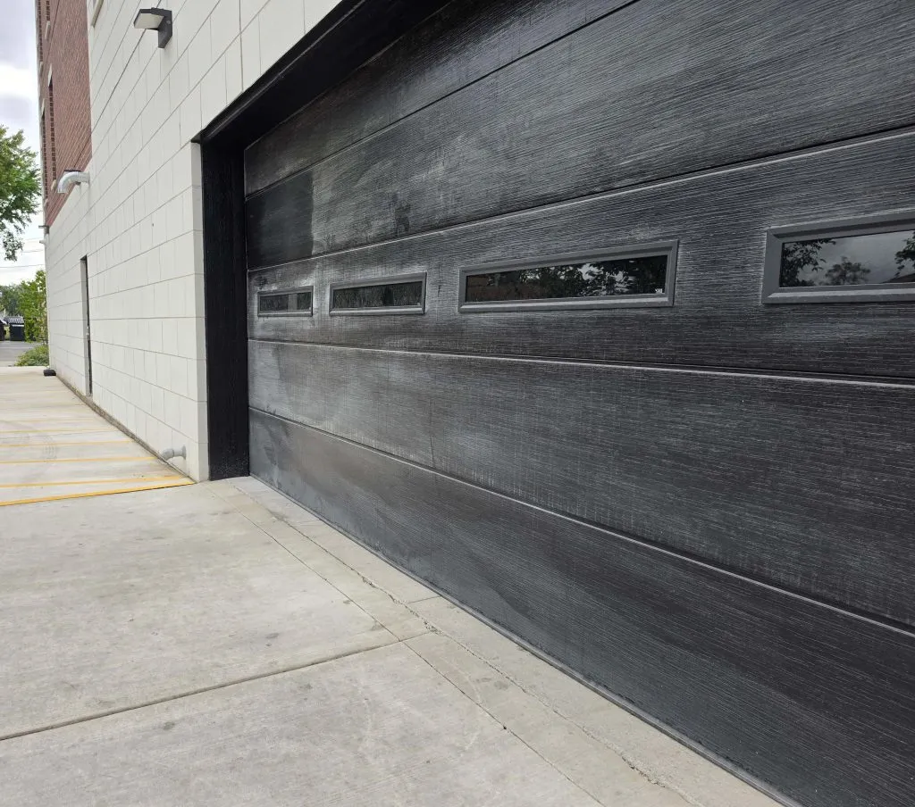 Garage entrance and adjoining block wall at a Niles building.
