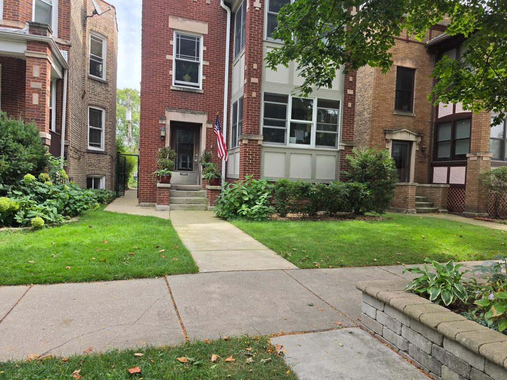 Brick home and front planting bed in Ravenswood.