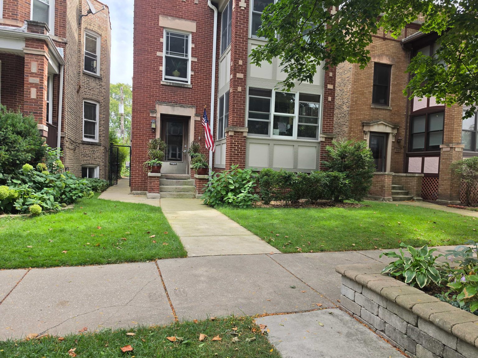 Brick home and front planting bed in Ravenswood.
