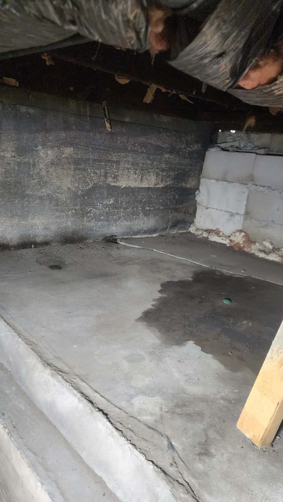 Concrete platform beneath an exterior stair area.